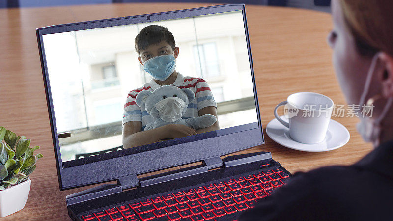 Health worker mother watches her son from afar. Little boy in quarantine, Covid 19 concept.